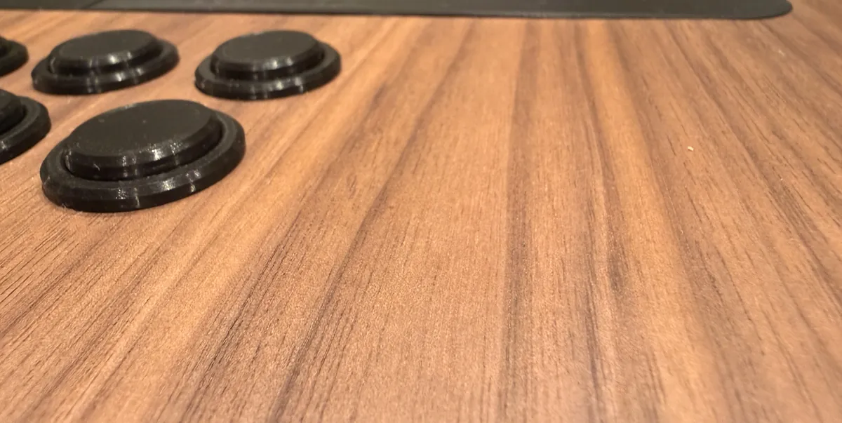Photo of the screen set into the walnut, the stick in front of it