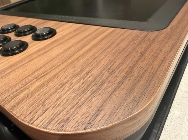 Close-up of the walnut top and its rounded edge